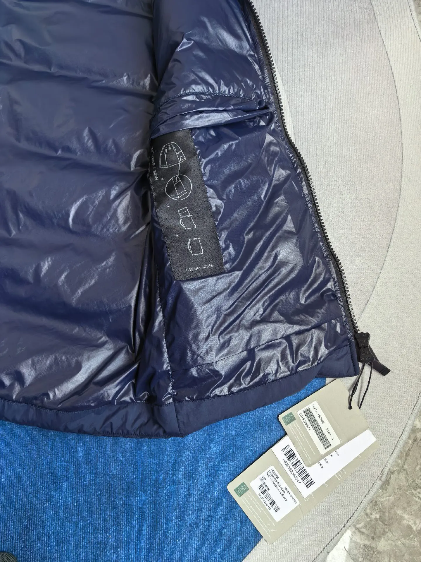 Style number: Y MB style Crofton men's black label down vest. This vest is lightweight and easy to fold and store, making it an ideal travel companion. This piece is made from sustainable materials and treated to be water-repellent, making it Wear-Resistant. Features zippered hand pockets lined with tricot. Color: Dark Blue Size: S M L XL XXL
